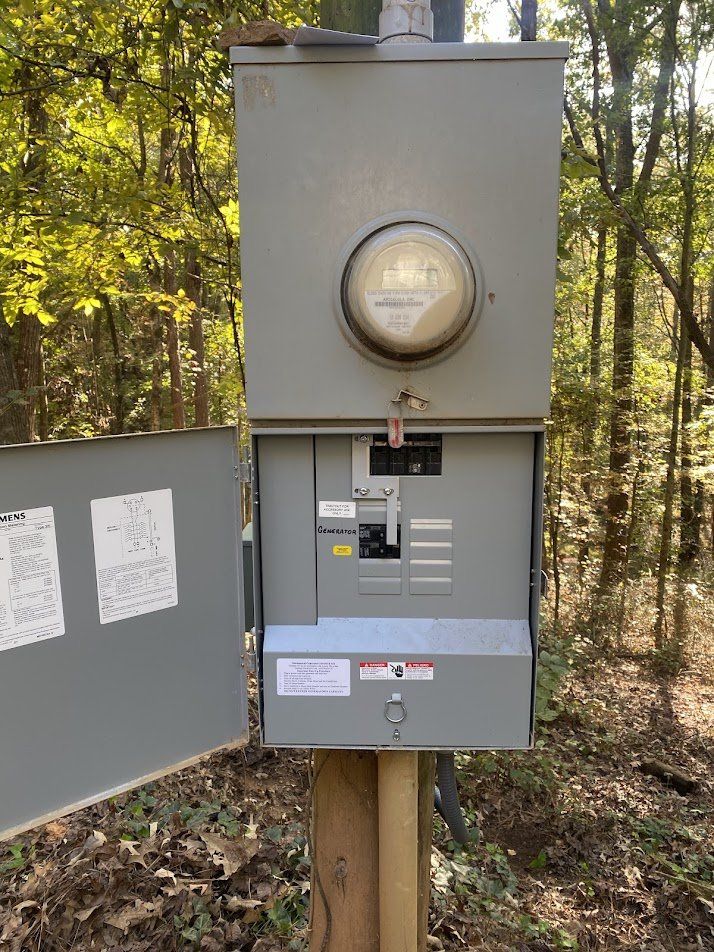 Pole-mounted meter main with a labeled generator breaker