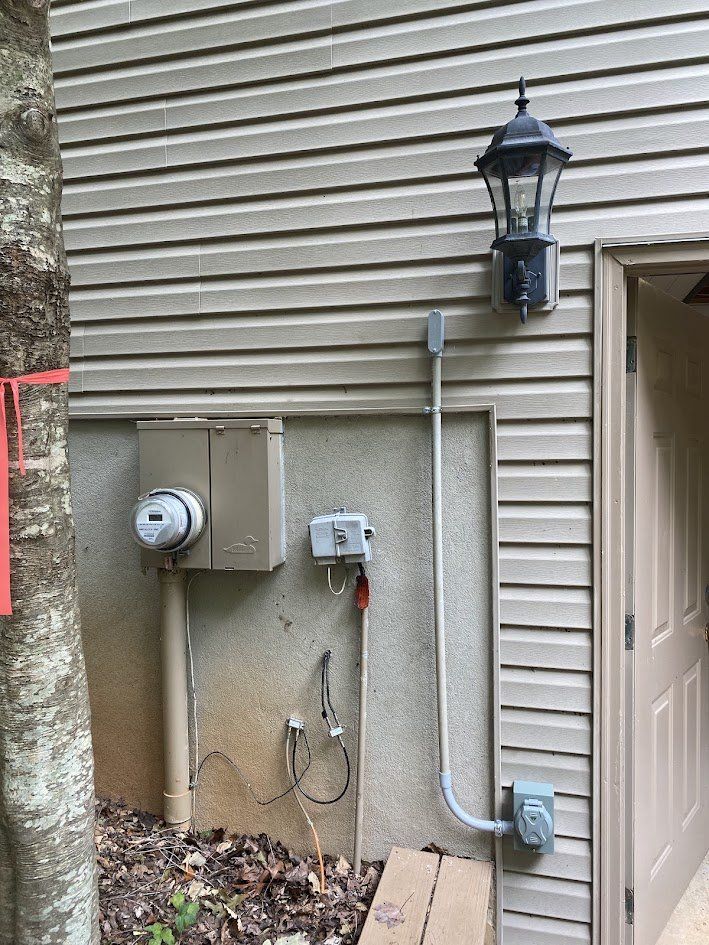 Portable generator inlet installed outside with conduit to the house