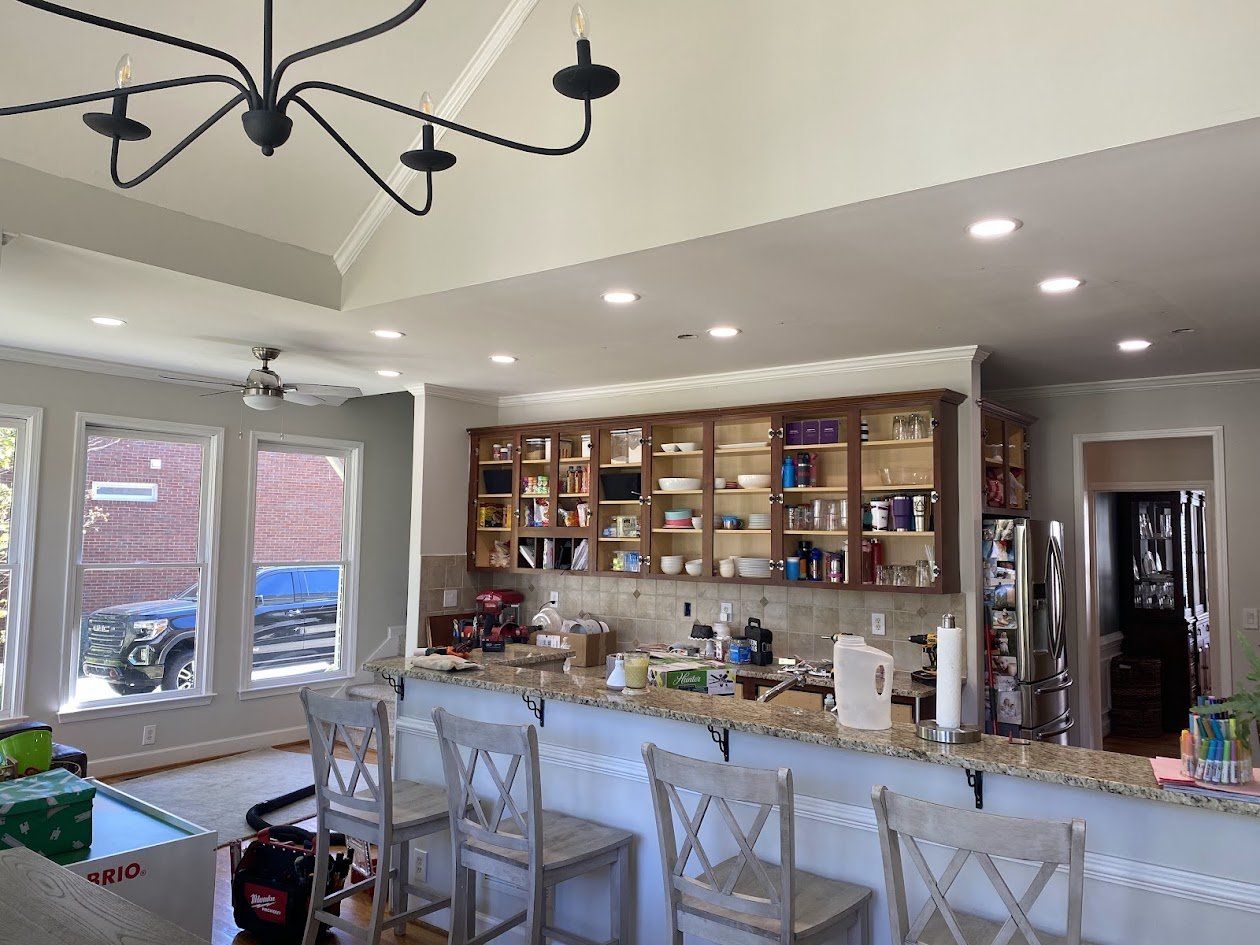 Kitchen with new recessed lights and a ceiling fan installed and on