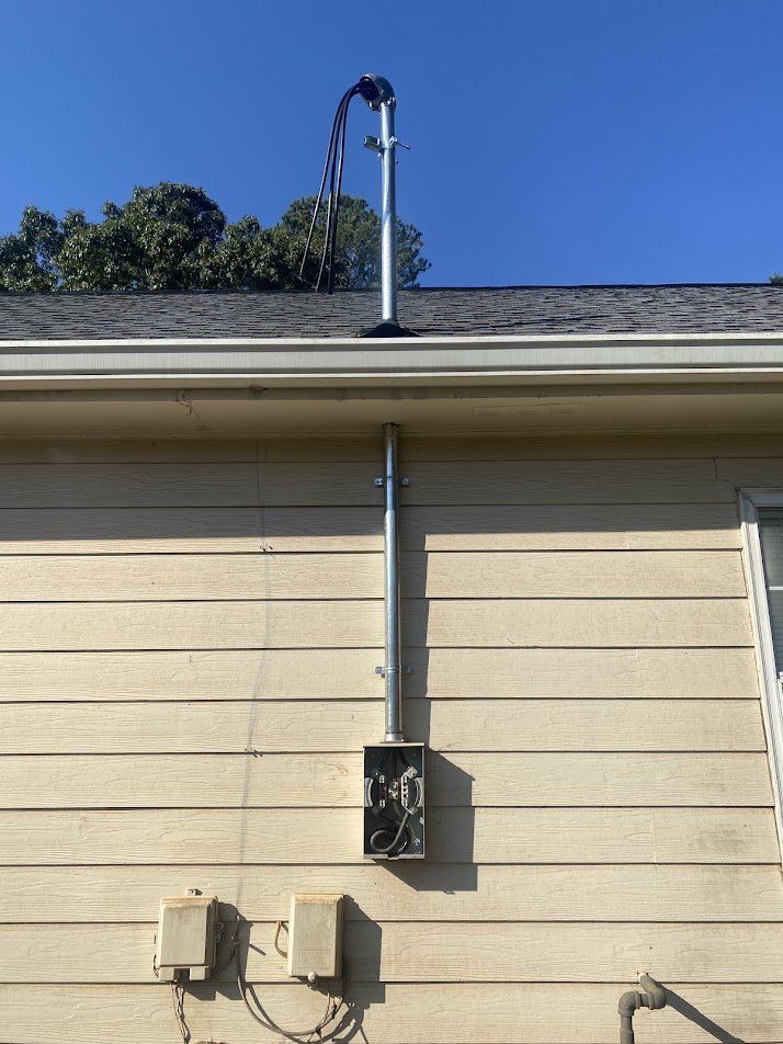 New straight service mast through the roof with a new meter base mounted