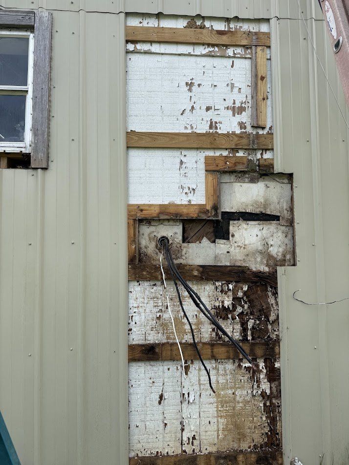 Wall opened up after removing the old service equipment